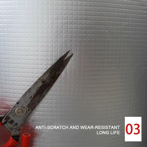 Super Sticky High Density Acoustic Foam Wall Panels With Built In Aluminum Foil, showing scissors cutting the textured material.