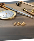 9 Piece Grease Fitting Kit With Copper Nozzle Caps For Cars And Trailers, including straight and angled nipples on wood surface