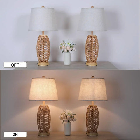 Image showing two wicker table lamps in on and off state, with a small vase in between on a tabletop.