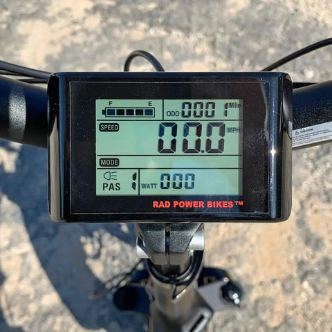 Waterproof LCD Bike Display And Computer For 48V Ebikes showing speed and mileage on handlebar mount