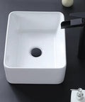 Vessel Sink 22 x 15 Inch White Ceramic Above-Counter Bathroom Sink, Rectangular Vessel Wash Basin for Vanity, top view on black counter