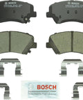 Bosch BC1543 QuietCast ceramic front brake pad set; includes two pads, hardware clips, and lubricant.