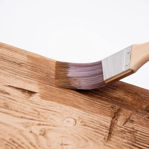 4 Oz Champagne Mist Touch Up Paint Kit For Faux Wood Beams And Trim Includes Custom Color Matching Tints To Repair Scuffs And Chips With No Sweat For A Slick Home Upgrade In Minutes, brush applying paint on faux wood surface.