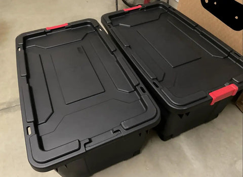 Set Of 2 40 Gallon Industrial Tote Bins With Wheels Heavy Duty Plastic Storage Containers with red latches and drip resistant lids.