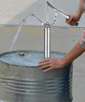 Heavy Duty Manual Oil Drum Pump With Ergonomic Handle For High Pressure Transfer And Effortless Sump Cleaning in use on oil barrel.