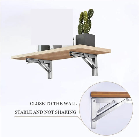 Heavy Duty Rock Solid Folding Wall Mount Shelf Brackets Crafted From Premium Stainless Steel With A Durable Matte Black Coating, displaying stable shelf setup with cactus.