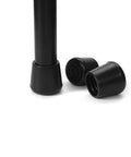 Close-up of No Slip Rubber Chair Leg Tips Caps Three Quarter Inch Inner Diameter Floor Protectors Round Black 16 Pack with one cap on leg.