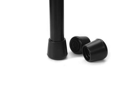 Close-up of No Slip Rubber Chair Leg Tips Caps Three Quarter Inch Inner Diameter Floor Protectors Round Black 16 Pack with one cap on leg.