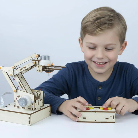 Child using Hands On Robotic Arm Kit For Kids Teens And Adults A Real STEM Toy With Motors Microcontroller Boards And Wires Learn Circuits