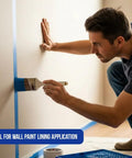 Man painting wall with a 2-inch angled sash brush from Top-Notch 10 Pack Wall and Trim Paint Brushes Set for Pros and DIYers