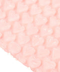 Close-up of Pink Heart Shaped Bubble Mailers Pack 50 Lightweight Shockproof Envelopes interior cushioning bubbles.