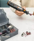 Person using 8V Cordless Rotary Tool With Internal Battery, Lightweight And Compact, Variable Speed Up To 28,000 RPM, Brushless Motor