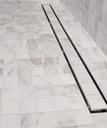 30 Inch Linear Shower Drain With Tile Insert Grate And Hair Strainer Includes Leveling Feet 2 Inch Center Outlet 304 Stainless Steel Tileable Top Grate For A Sleek Modern Look And Easy Cleaning in tiled floor.