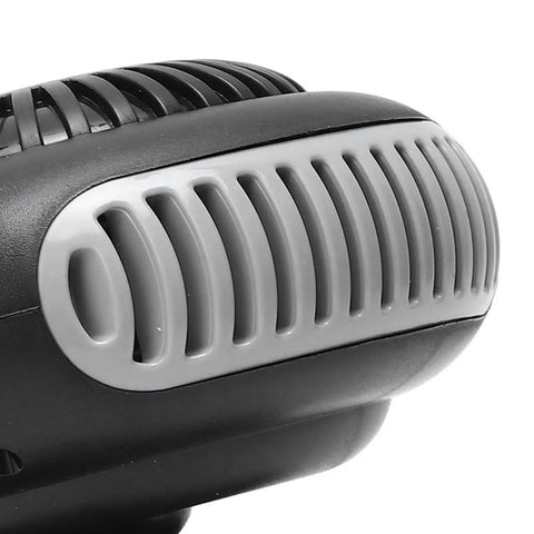 Close-up of Compact Portable Heater Pumping Out Kickin Warmth Indoors with dual temp settings. Black and gray design.