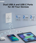 Three Port USB C Wall Outlet With 30W Fast Charging And Dual USB A Ports for All Your Gadgets in use charging phone and tablet