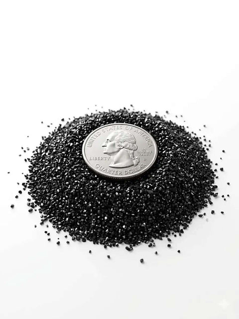 Thermally Activated GAC Carbon Filter granules with a quarter for size comparison, ideal for 3D printers and laser engravers, 1 lb pack.