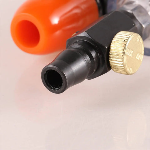 Close-up of Khbyt Tube Cooling Vest Accessory connector with orange nozzle and black fitting for industrial use.