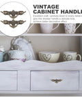 Vintage Cabinet Handles 4.33 Inch Antique Brass Drawer Pulls on white dresser with decorative cups and teapots.