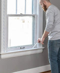 Indoor Window Shrink Film Insulation Kit For Five Windows 62 Inch By 210 Inch Crystal Clear Film With Eighty Four Foot Double Sided Tape No Muss No Fuss Install And Seal Drafts While Boosting Home Energy Efficiency application on window frame.