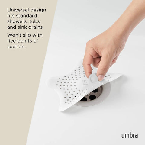 Heavy Duty Starfish Hair Catcher With Rock Solid Suction Cups For Bathtub Drains in use with suction pads on drain.
