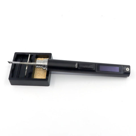 TS21 Pro Grade Soldering Iron Kit with OLED display and solder tip in black aluminum alloy lying on a stand