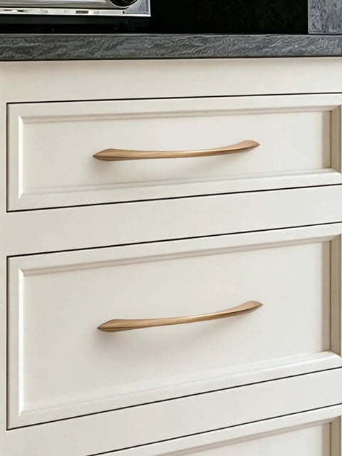 Champagne Bronze Cabinet Pulls 7.56 Inch Arch Twisted Brass Handles 5 Pack on white kitchen drawers