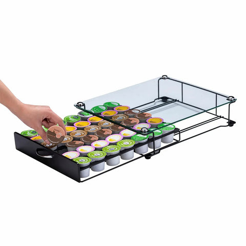 Hand reaching into K Cup Holder Drawer With Crystal Tempered Glass Top, Heavy Duty Metal Coffee Pod Organizer, holding 42 K Cups.
