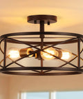 Three Light Semi Flush Mount Ceiling Light With Industrial Modern Farmhouse Style And Metal Cage 14 Inch Wide Oil Rubbed Bronze Finish E26 Base Rustic Yet Sleek Kitchen Hallway Living Room Bedroom Fixture with bulbs glowing inside metal cage.