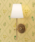 Level Up Your Interiors With This Stunning Cottage Floral Gold Metallic Wallpaper Showcasing Rich Fibrous Texture And Effortless Paste Application For Ultimate Room Refresh Vibes with a stylish wall sconce.