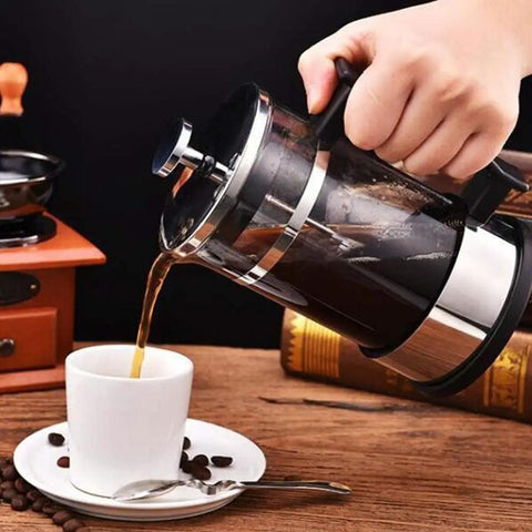 French Press Coffee Maker With Ergonomic Handle, Food Grade Stainless Steel Turkish Coffee Pot And Espresso Brewer pouring coffee