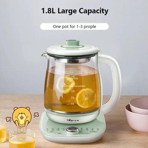 All In One Health Pot Electric Kettle With Infuser, Glass Kettle And Stew Pot, 1.8L Capacity, Green, with lemon slices inside