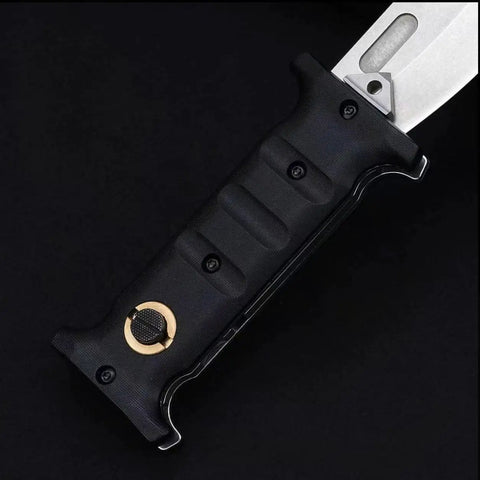Close-up of folding hunting knife with D2 steel blade and non-slip G10 handle for outdoor tactical camping and survival use.
