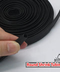 Top Notch 3/8 Inch Heat Shrink Tubing Roll 25 Feet Long with hand holding end from roll, showcasing black tubing for cables.