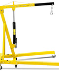 Heavy Duty Folding Engine Hoist With Adjustable Telescopic Boom two ton in yellow color for garage use, featuring smooth rolling casters.
