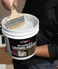 Person applying Brushable Chimney Crown Repair Elastomeric Waterproof Coating for Crowns and Masonry Flexible Sealant Prevents Leaks Cracks Quick Setting Long Lasting Protection 2 Gallon on a rooftop