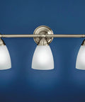 Brantford 3-Light Vanity Fixture In Chrome With Frosted Glass, Dual Mount Bath Light on blue background