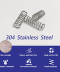 Front view of several small 304 stainless steel compression springs, 1/2 in diameter by 1-1/2 in length, on white background