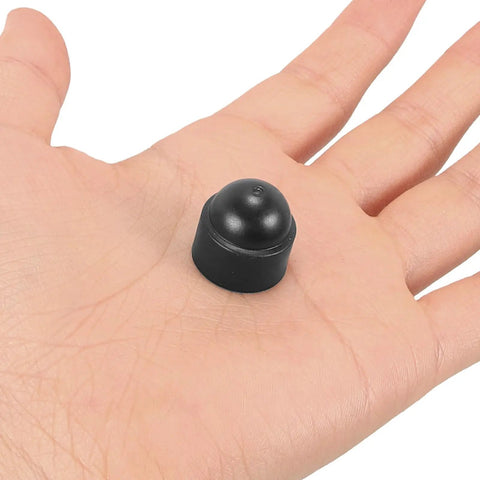 Hand holding M8 Plastic Hexagonal Dome Nut Caps Black Screw Protectors For Exposed Ends And Wire Insulation Sturdy Covers