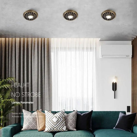 Six Pack Top Shelf Adjustable Color Temperature LED Recessed Can Lights 4.5 Inch Flush Downlights with Brushed Brass trim in ceiling.