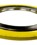 Spiral-wound gasket with yellow outer ring and metal inner spiral.
