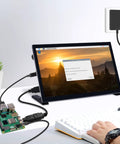 Dope 27W USB C PD Power Supply For Raspberry Pi 5 Charger with cables connected to monitor and keyboard in home setup