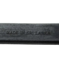 Close-up of black natural rubber with 'Made in Sri Lanka' imprint for 50 Pack Tarp Straps For Flatbed Trailers 9 Inch Long Natural Rubber Bungee Tie Downs With Metal S Hooks Built For Cold Weather And Heavy Cargo Perfect For Tarps Canvases Campers RVs Box Trucks Or Motorcycle Gear