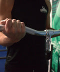 Man using Aluminum Revolving Curl Bar With Cable Attachments For Functional Trainers And Gym Cable Machines, Built To Last For Bicep Curls
