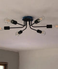 Six Light Semi Flush Mount Sputnik Ceiling Light Fixture Slick Black Metal Chandelier With E26 Base installed in room