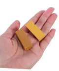 Hand holding two wax sticks from Eight Pieces Furniture Wax Crayons For Wood Floors And Furniture Repair Quick Scratch Fix Chip Holes.