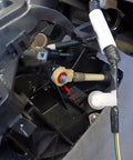 Installation of Upgraded Shifter Cable Bushing Kit for Toyota Sienna and Nissan Altima with visible components.