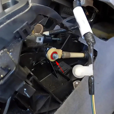 Installation of Upgraded Shifter Cable Bushing Kit for Toyota Sienna and Nissan Altima with visible components.