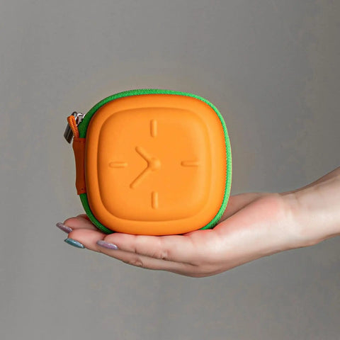 Heavy Duty Eva Travel Case For 140W Fast Charger And Usb C Cable Organizer in orange and green held in hand.