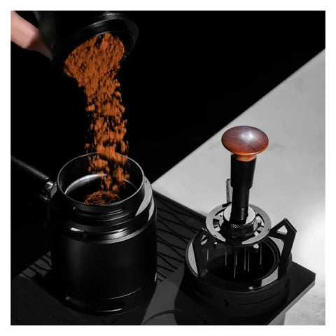 Smooth Operator Espresso Rotary WDT Tool And Coffee Stirrer With Built In Dosing Funnel Stand For Even Powder Distribution and Knockout Barista Shots At 54mm with coffee grounds being poured.