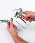 Hands connecting components of Pressure Roller Kit For Airless Spray Guns No Tool Attachment With EvenFlow Drip Free Paint Delivery